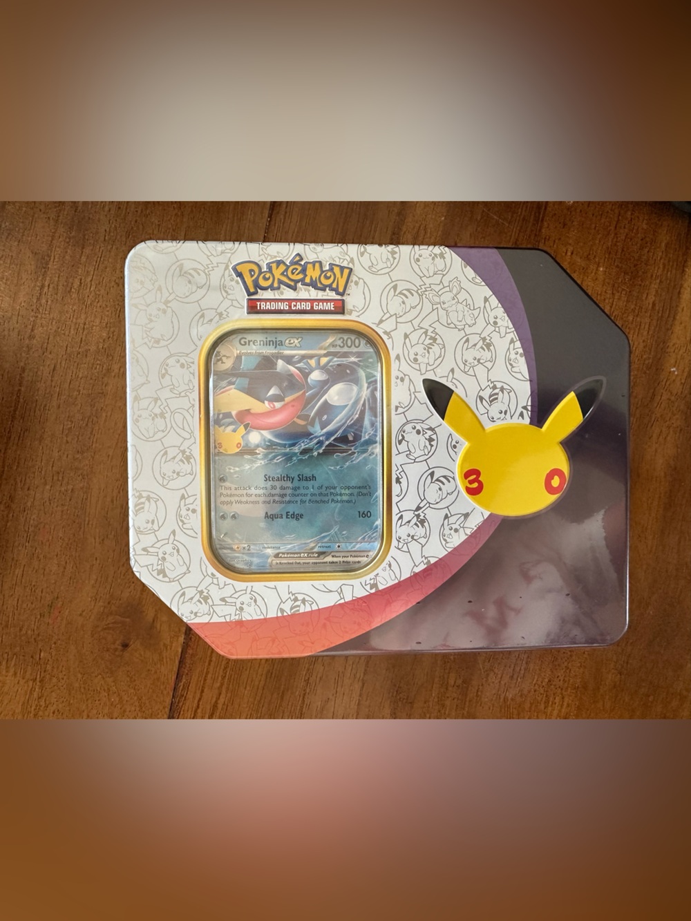 Pokemon Tin Featuring Greninja GX with Yellow Pikachu Accent